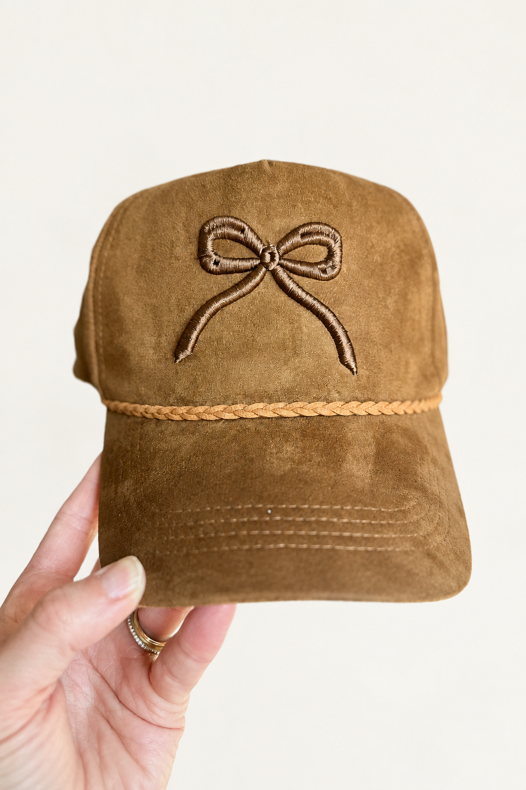 Hand-held bow hat, studio swap