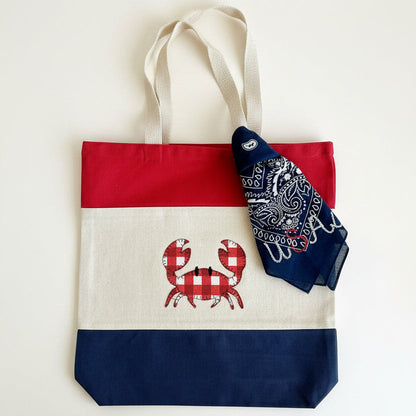 Tote bag with crab design and bandana on a white background