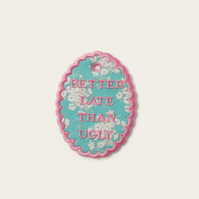 Decorative tag with floral design and text &