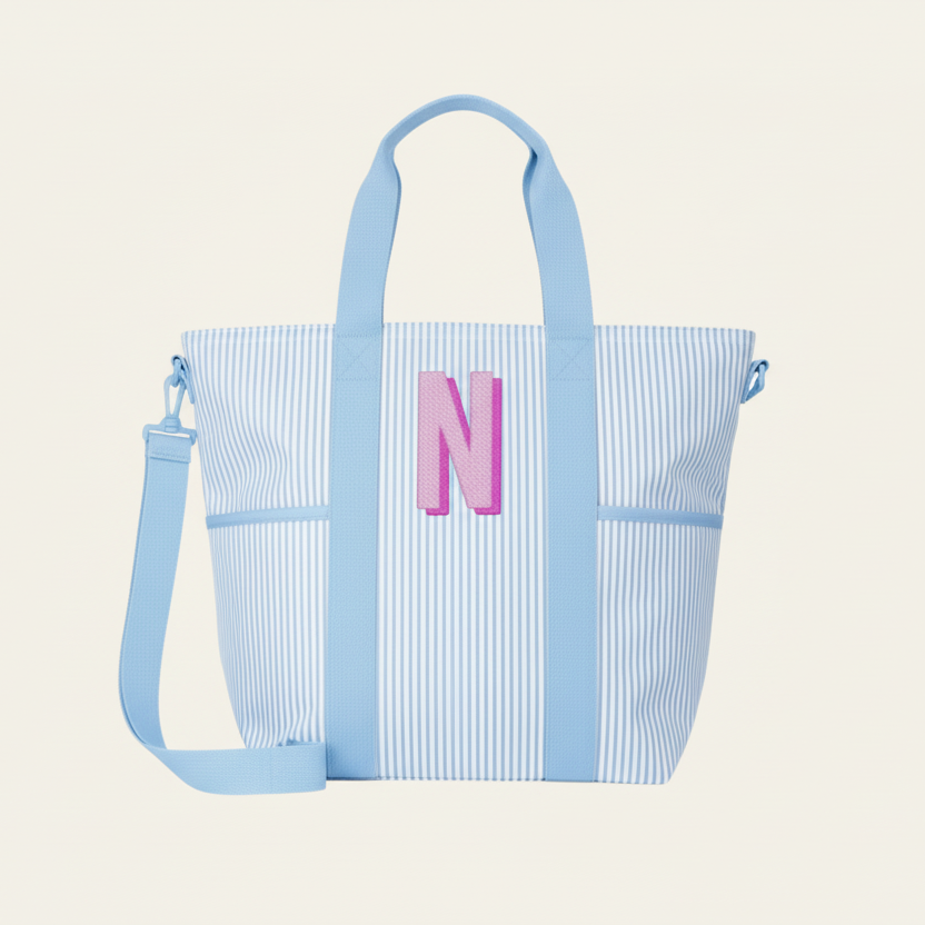 Blue striped tote bag with a pink letter &